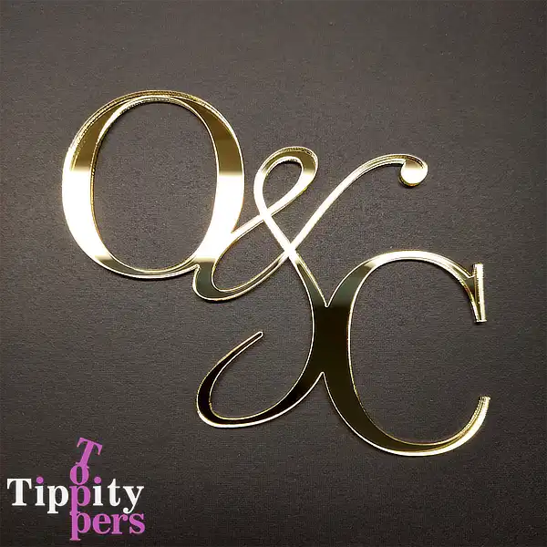 Personalized acrylic wedding cake charm with monograms