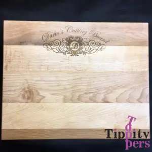 Cutting board with laser engraved monogram and name 