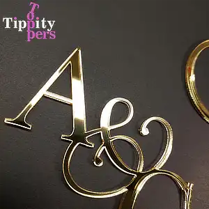 Acrylic engagement cake charm with monograms and topper with the future spouses engagement rings set